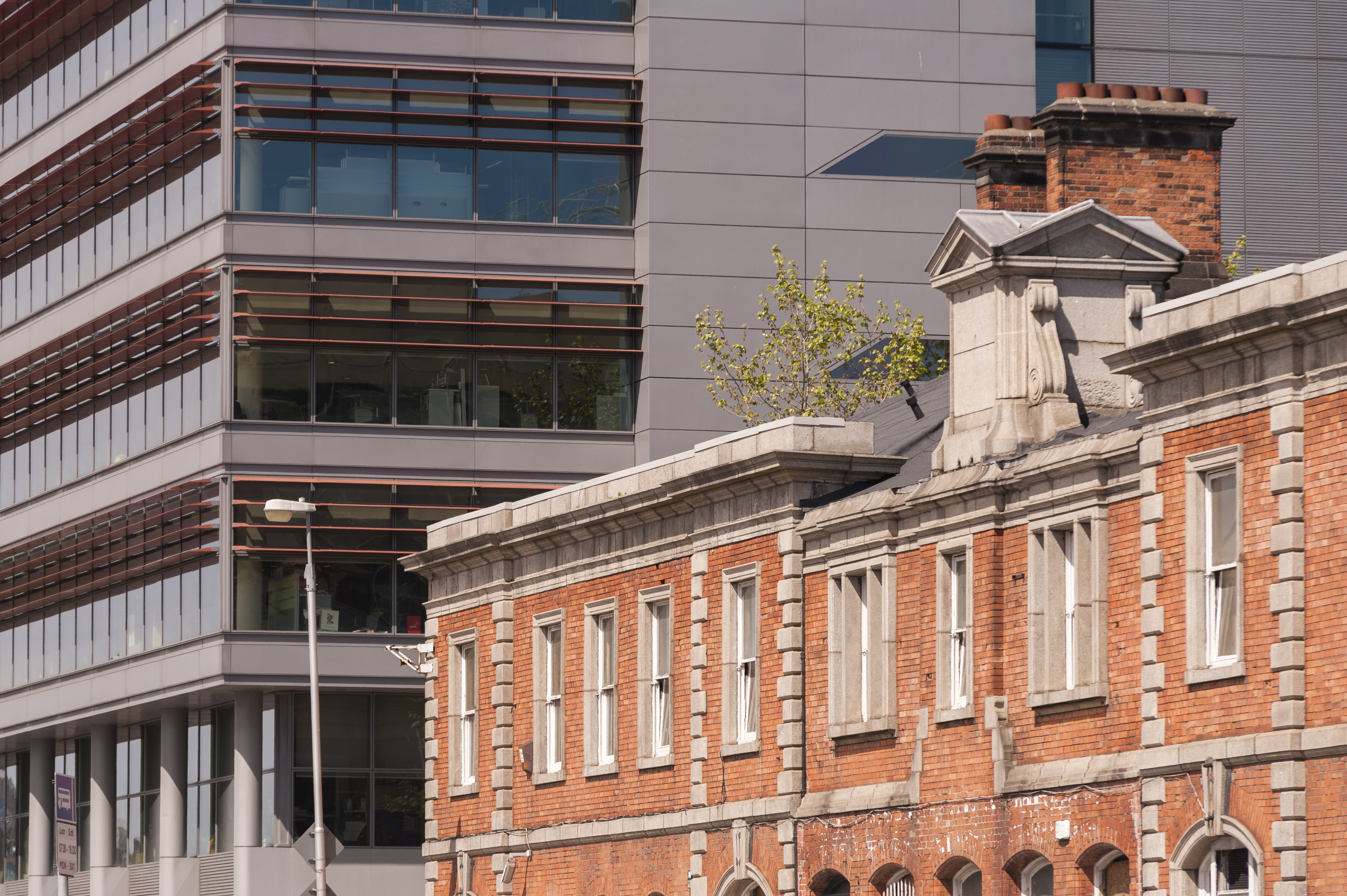 Red brick buildings in foreground 